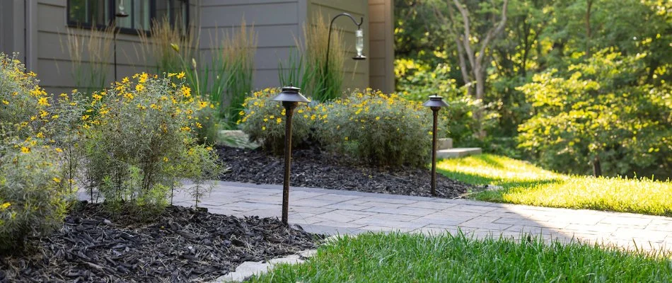 Outdoor lighting fixtures along a walkway in Omaha, NE.