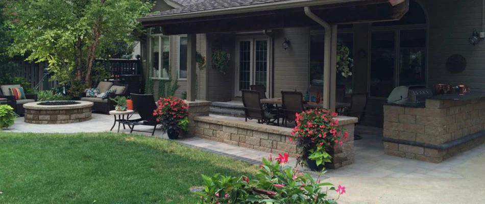 Outdoor living with dining table and fire pit near Omaha, Nebraska