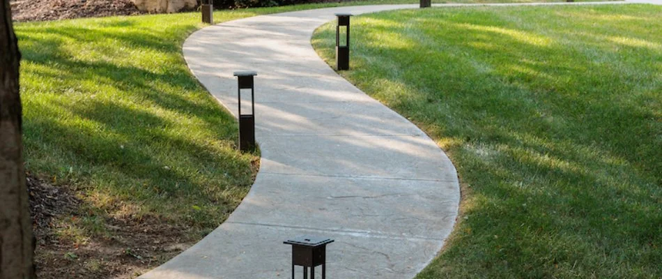 Curved walkway installation with modern lighting in Papillion, NE.