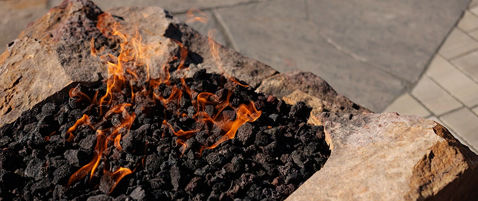 Fire feature with flames in Chalco, NE.